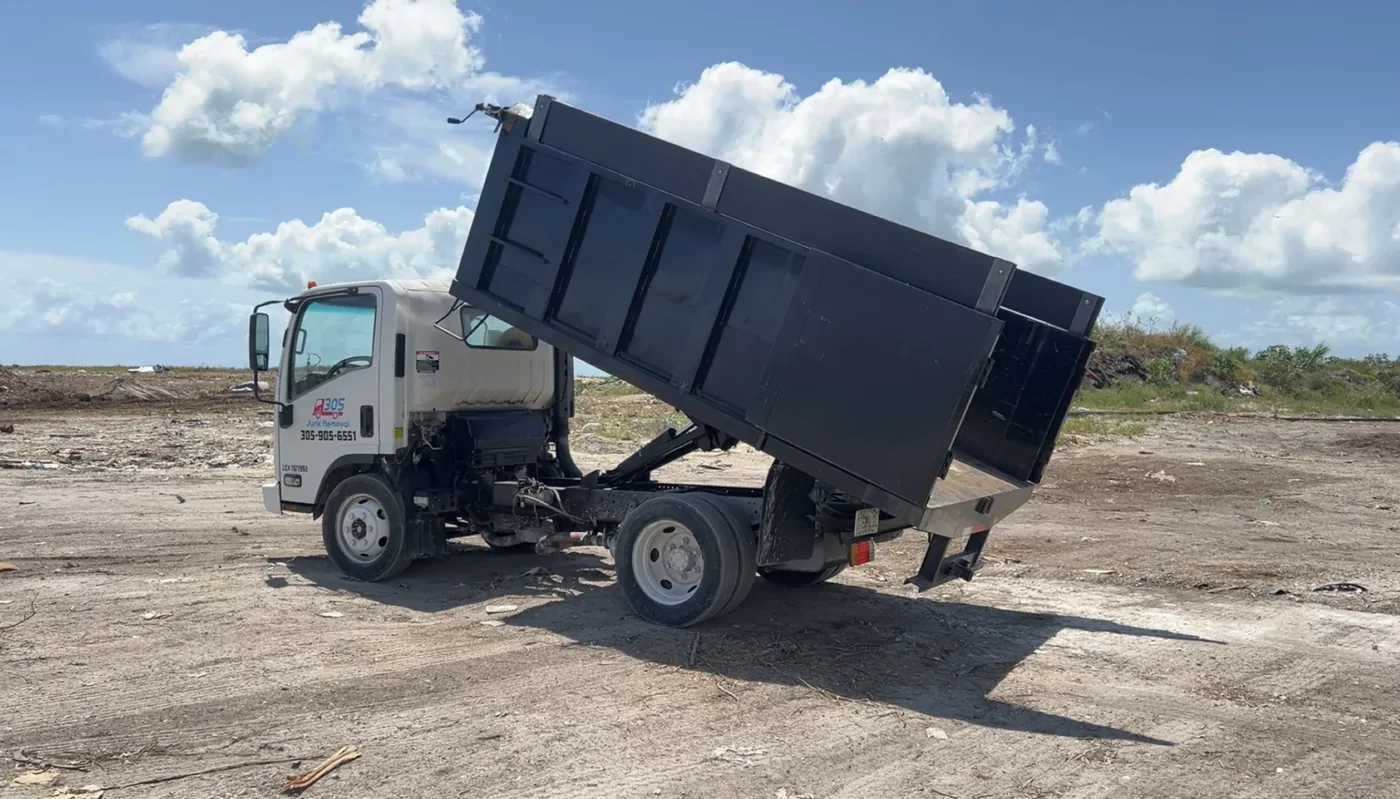 305 Junk Removal truck with its dump bed raised