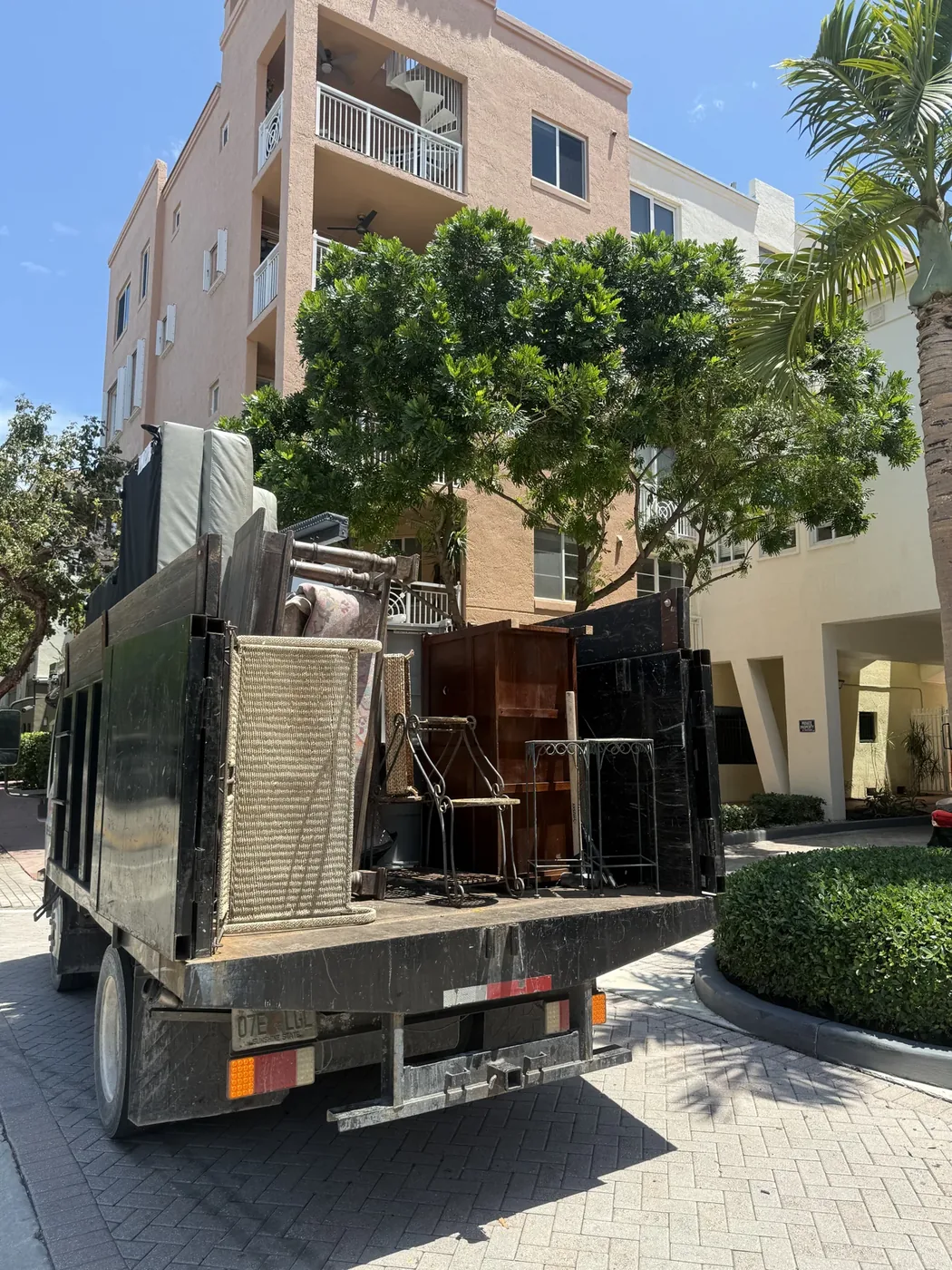 Furniture loaded in a truck outside an apartment building