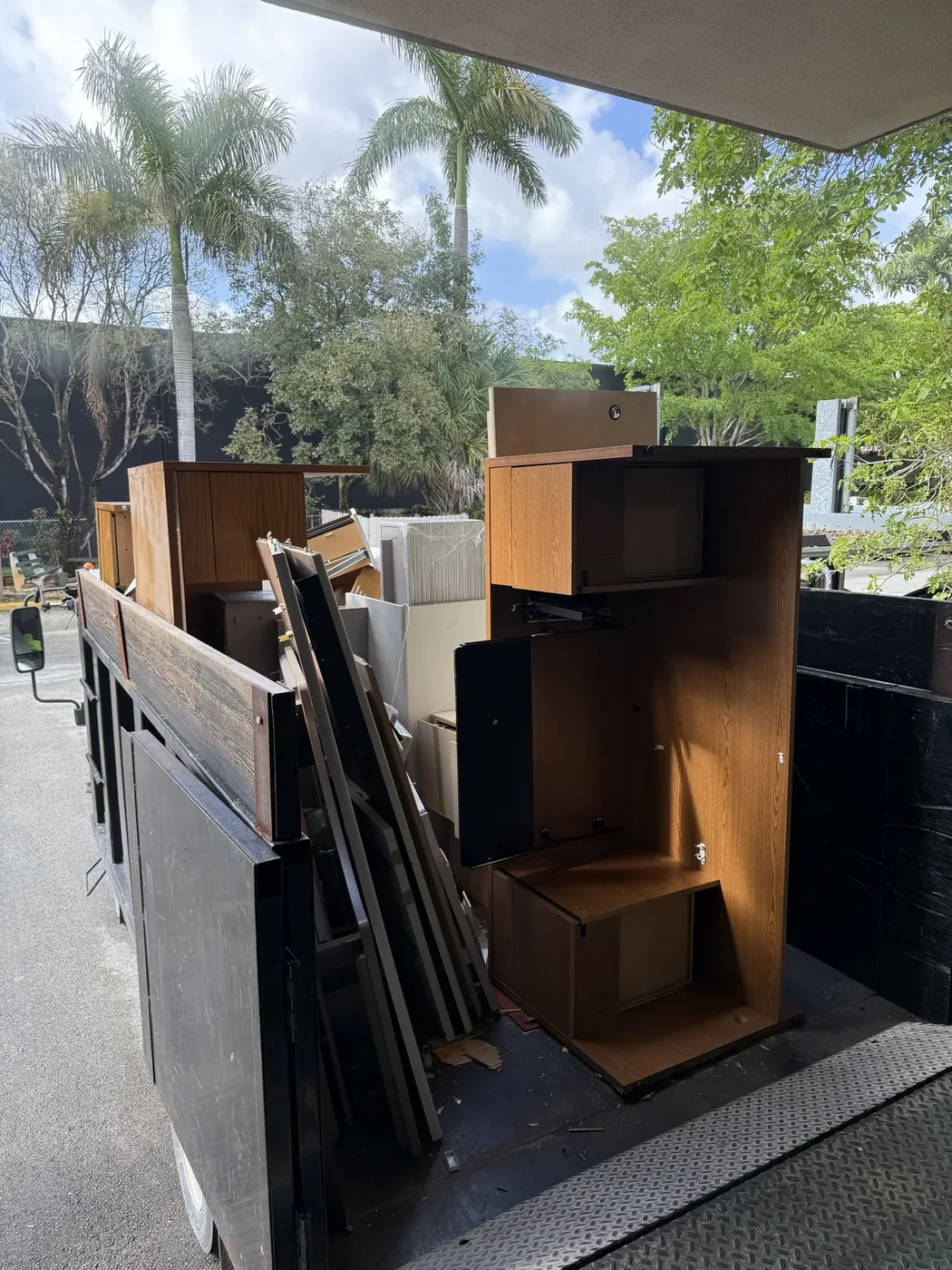Wooden shelving and furnishings loaded in a hauling truck