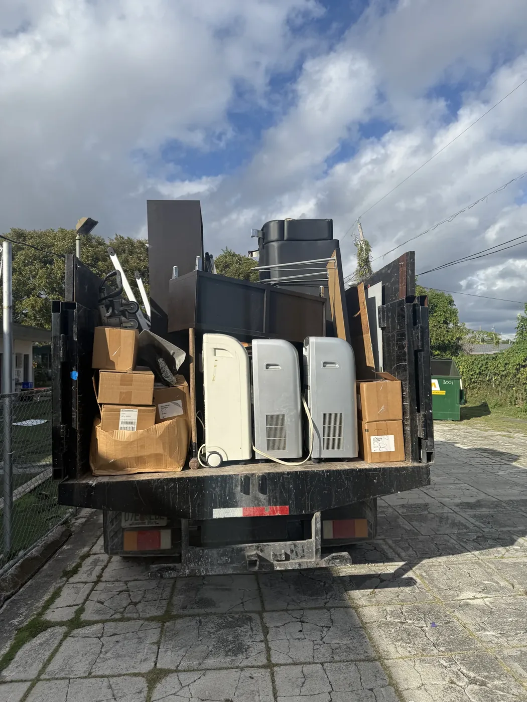 Household furniture, boxes and bulky items loaded for hauling