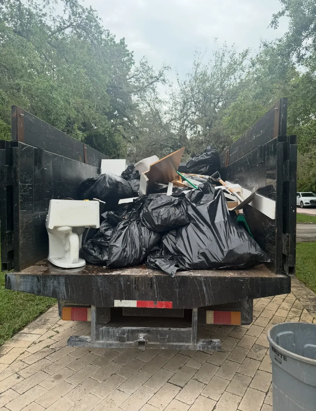 Bagged clutter, discarded fixtures and household debris in a truck